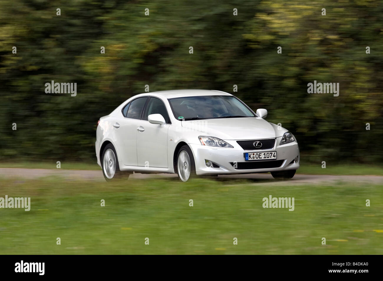 Lexus IS 250, model year 2005-, white, driving, diagonal from the front, frontal view, country road Stock Photo