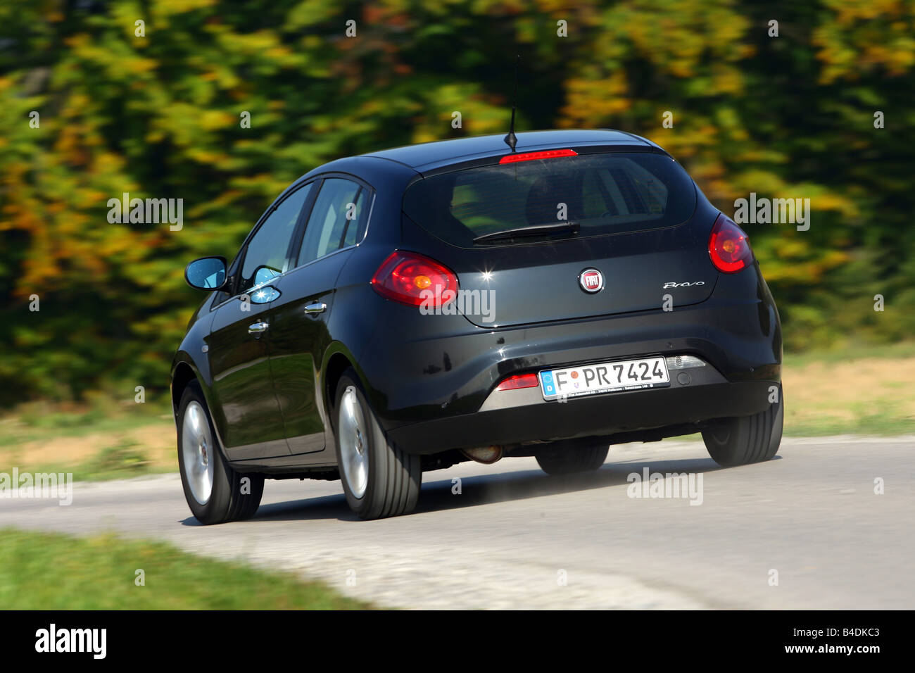 Fiat Bravo 1.4 T-Jet 16V Emotion, model year 2007-, black, driving, diagonal from the back, rear view, country road Stock Photo