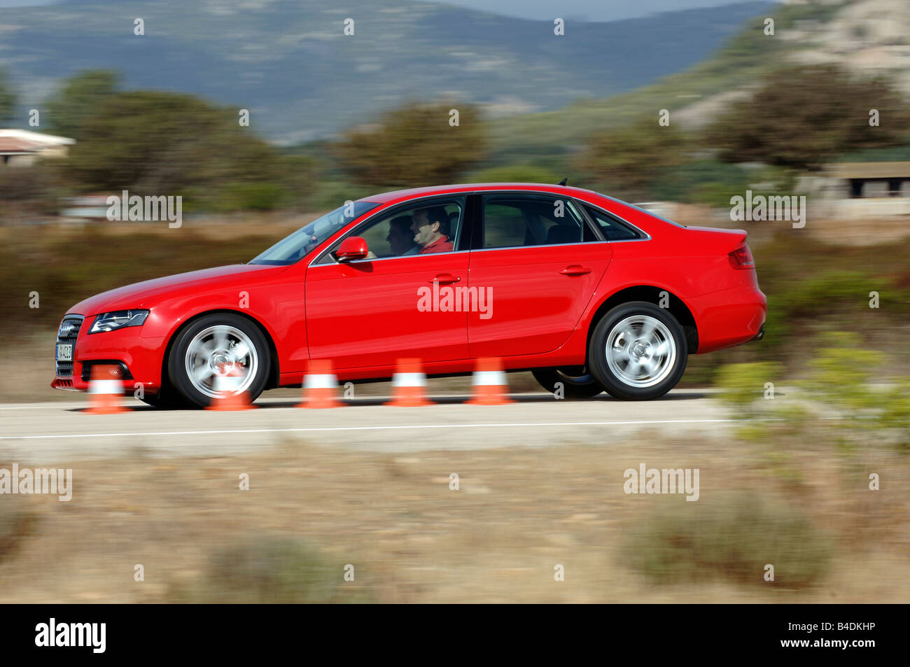 Audi A4 1.8 TFSI Ambition, model year 2007-, red, driving, side view, Pilonen, Test track Stock Photo