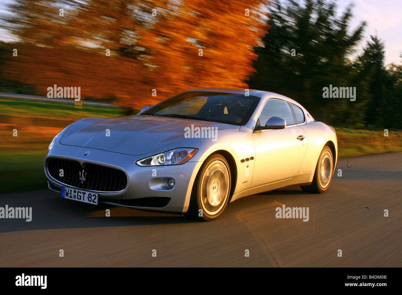 Maserati Gran Turismo, silver, model year 2007-, driving, diagonal from the front, frontal view, country road Stock Photo
