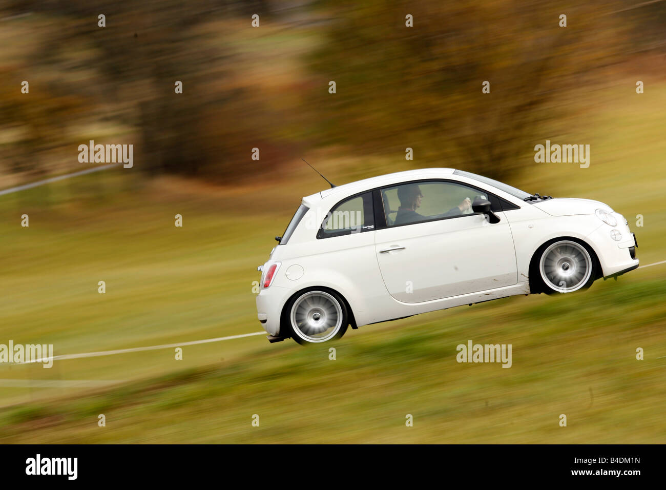 Fiat 500 Cartech-Knowledge, white, model year 2007-, driving, side view, country road Stock Photo
