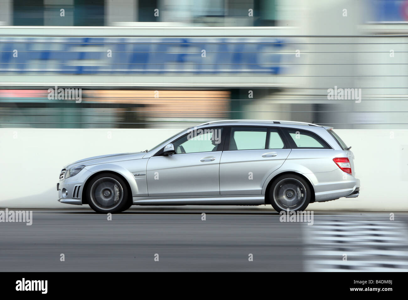 Mercedes C 63 AMG, model year 2008-, silver, driving, side view, test track Stock Photo