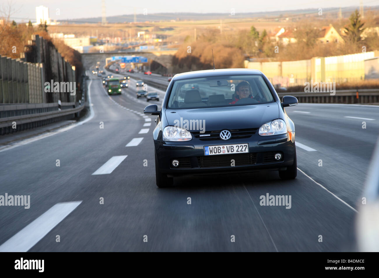 VW Volkswagen Golf Blue Motion, model year 2008-, dunkelblue moving, diagonal from the front, frontal view, Highway A81 Stock Photo
