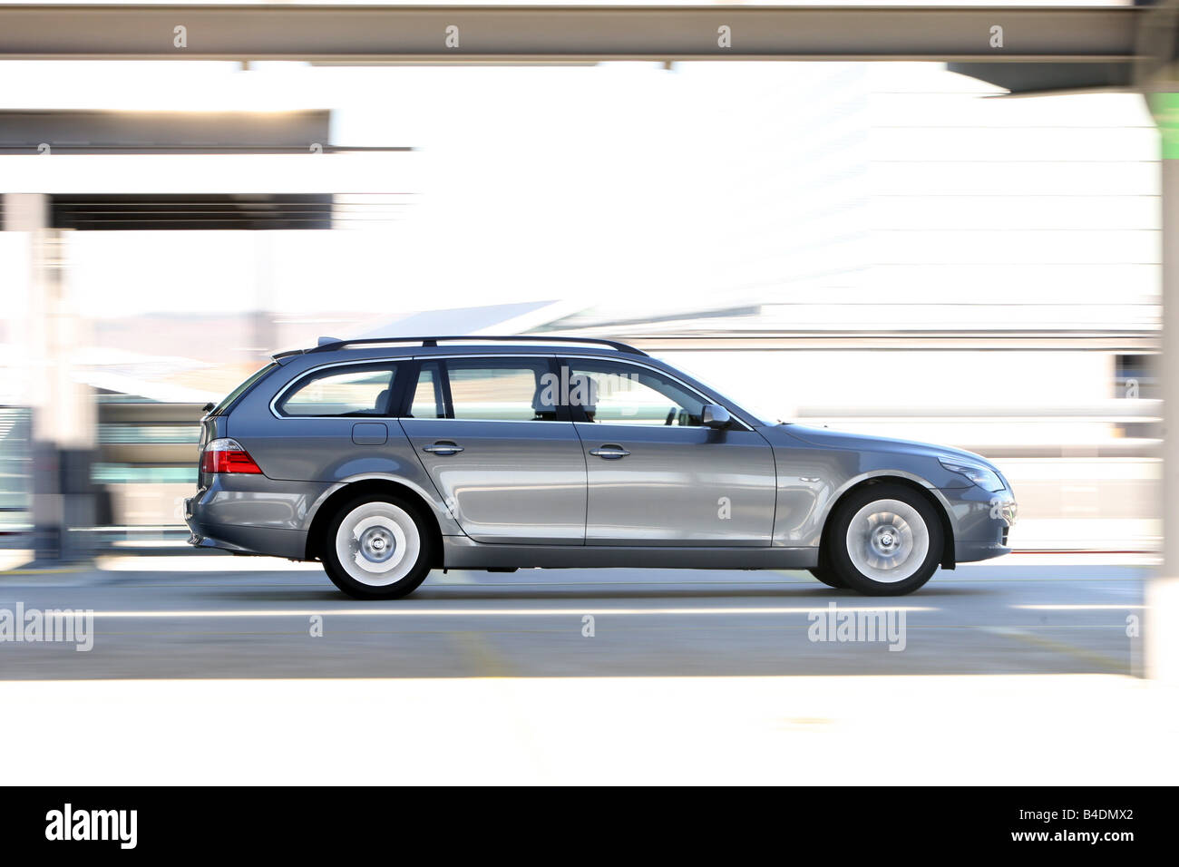 BMW 520d Touring, model year 2006-, anthracite, driving, side view, City Stock Photo