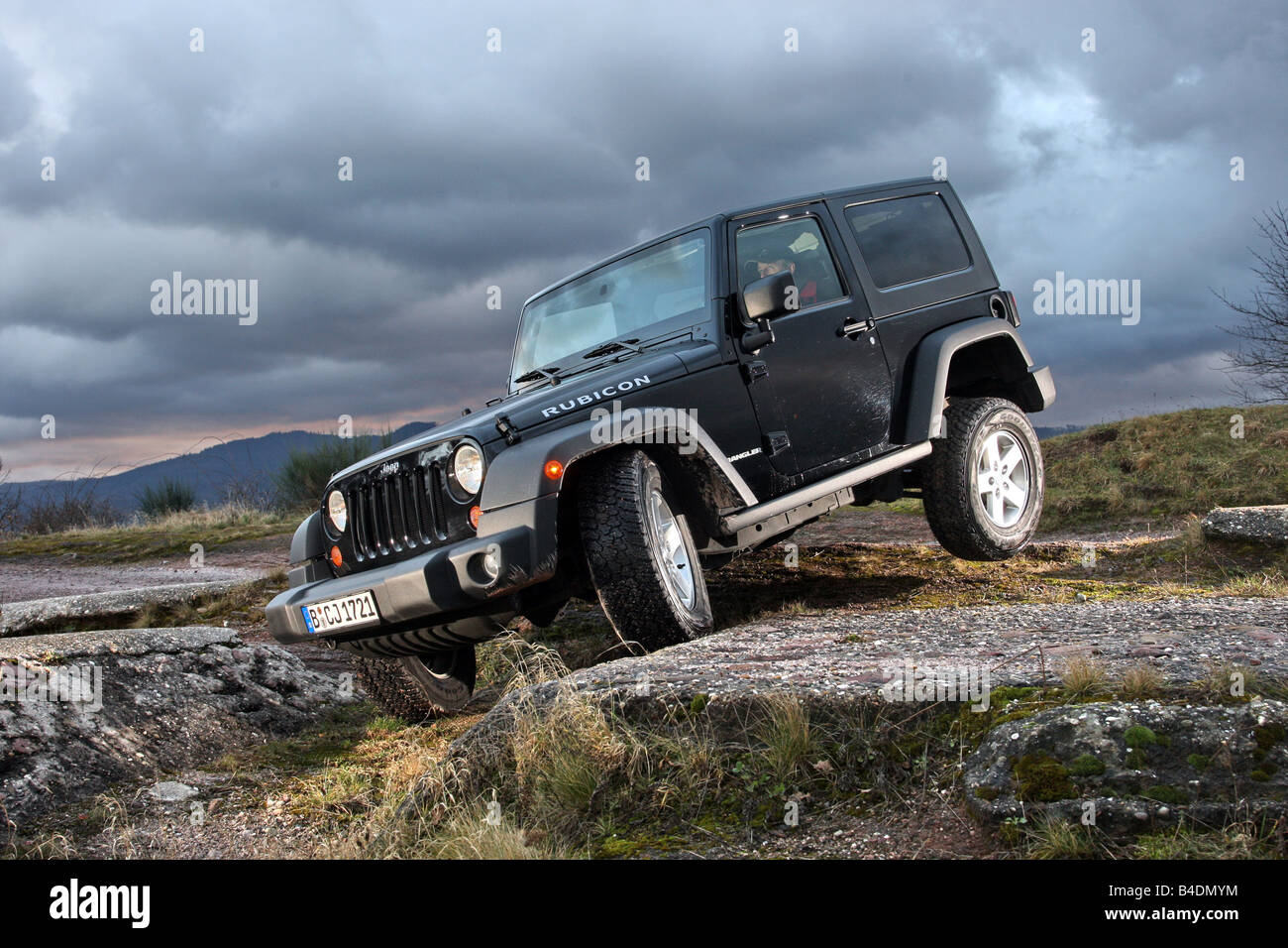 Jeep Wrangler Rubicon 3.8, model year 2008-, black, standing, upholding, diagonal from the front, frontal view, offroad Stock Photo