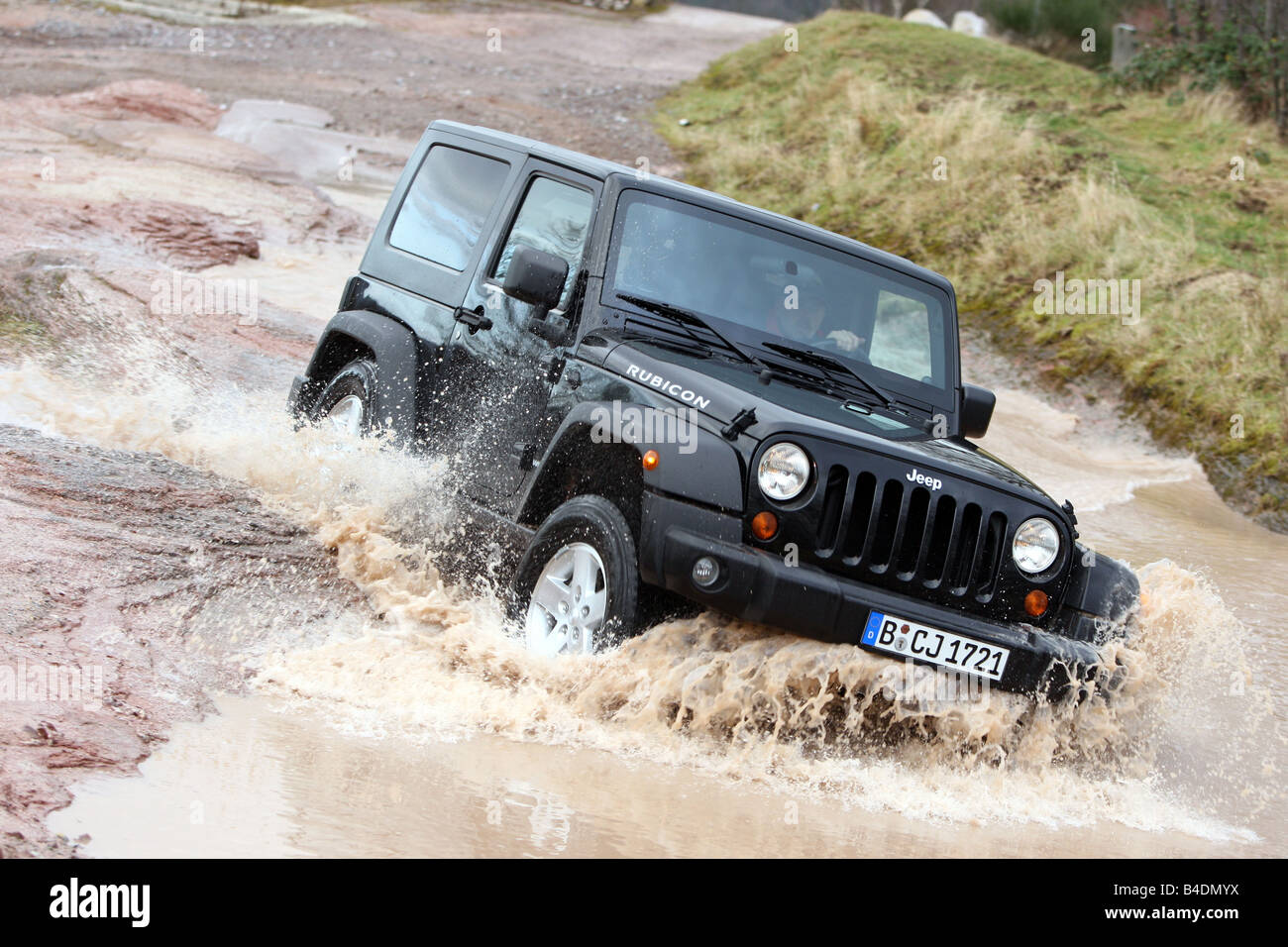 Jeep Wrangler Rubicon 3.8, model year 2008-, black, driving, diagonal from the front, frontal view, offroad, Water Stock Photo
