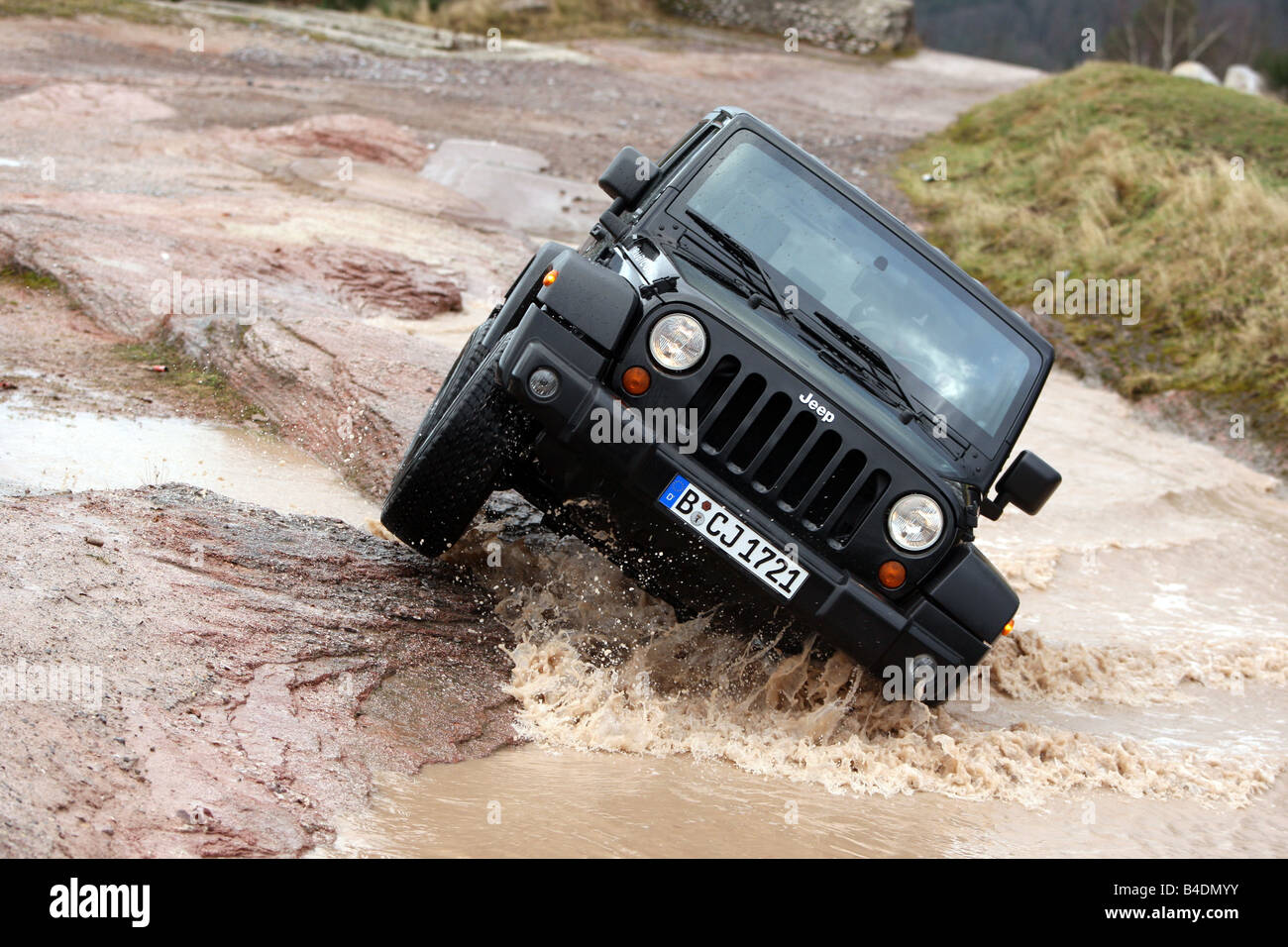 Jeep Wrangler Rubicon 3.8, model year 2008-, black, driving, diagonal from the front, frontal view, offroad, Water Stock Photo