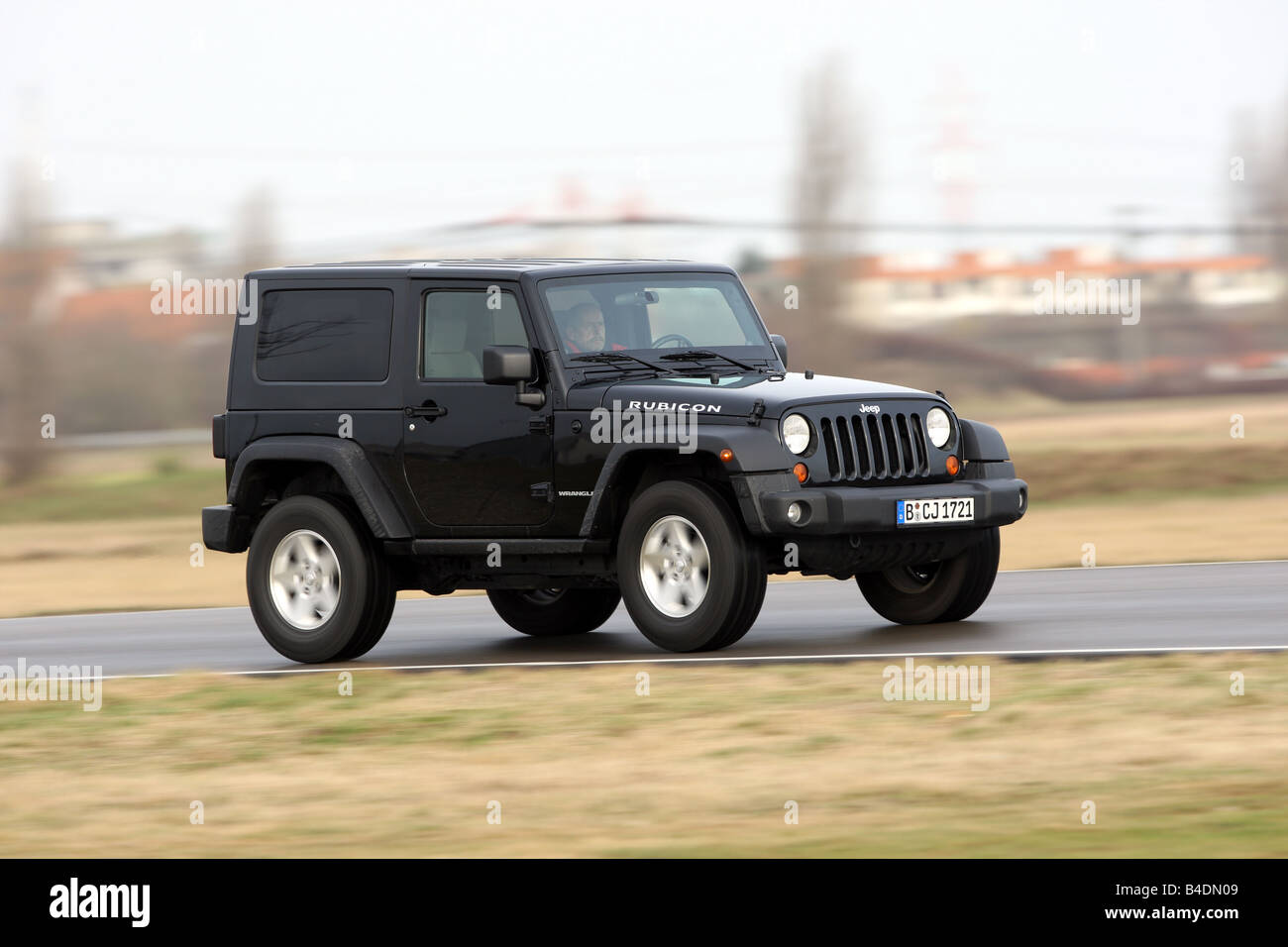 Jeep Wrangler Rubicon , model year 2008-, black, driving, diagonal from  the front, frontal view, side view, country road Stock Photo - Alamy