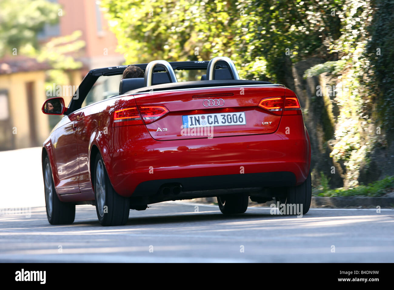 Audi A3 Convertible 1.8TFSI Attraction, model year 2008-, red, driving,  diagonal from the back, rear view, City, open top Stock Photo - Alamy