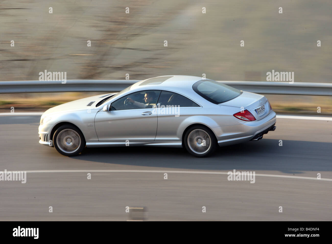 Mercedes CL 65 AMG, model year 2008-, silver, driving, side view, country road Stock Photo
