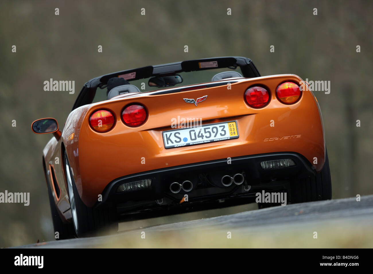 Corvette C6, rust-red model year 2008, orange -metallic, driving ...