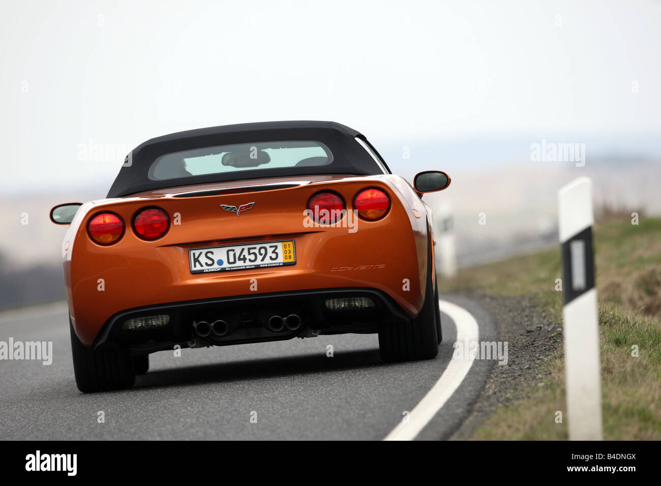 Corvette C6, rust-red model year 2008, orange -metallic, driving ...