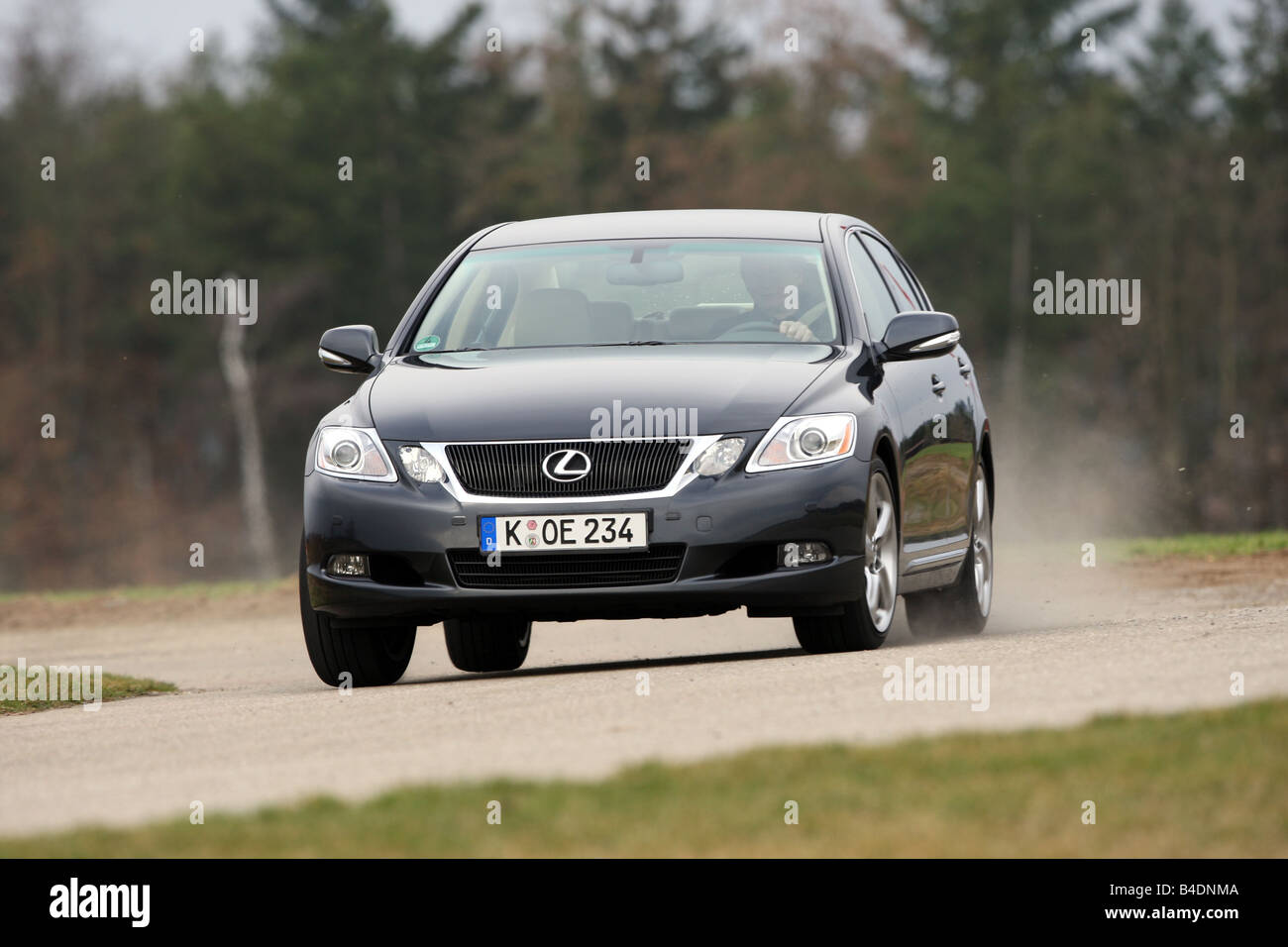 Lexus GS 460, model year 2008-, dunkelblue moving, diagonal from the front, frontal view, country road Stock Photo