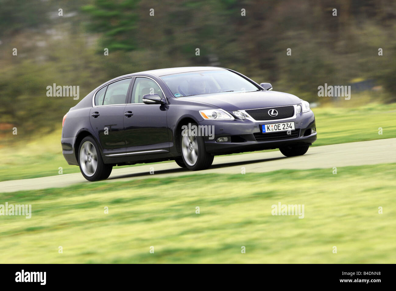 Lexus GS 460, model year 2008-, dunkelblue moving, diagonal from the front, frontal view, country road Stock Photo