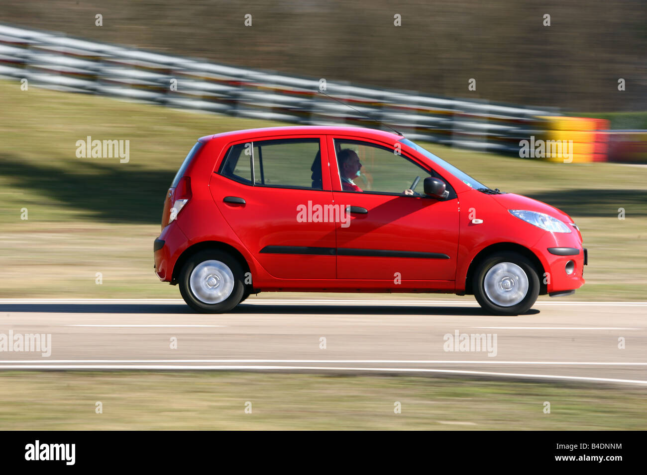 Hyandai i10 1.1 Classic E, model year 2008-, red, driving, side view, test track Stock Photo