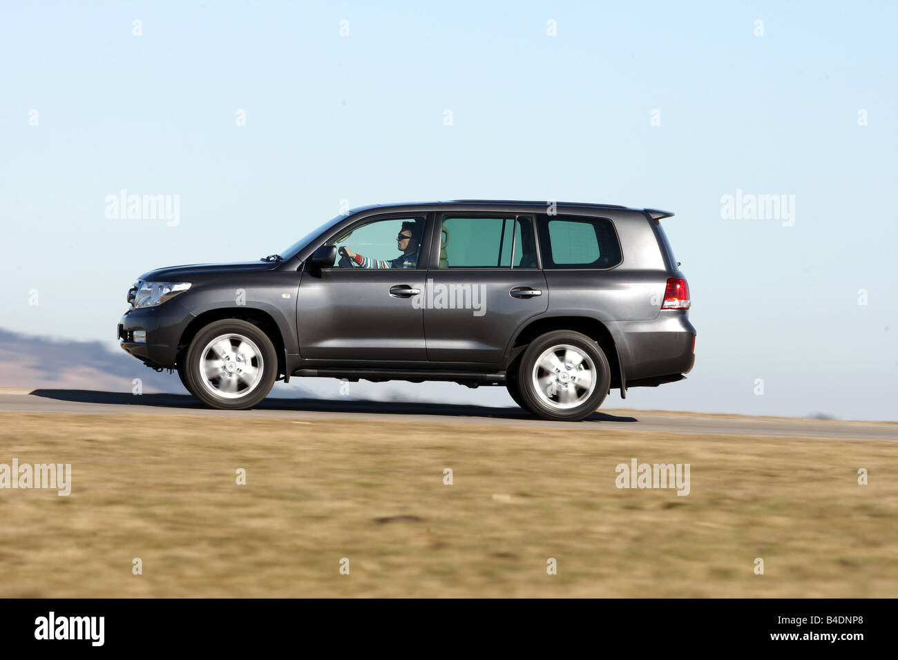 Toyota Landcruiser V8 4.5 D-4D, model year 2008-, anthracite, driving, side view, country road Stock Photo