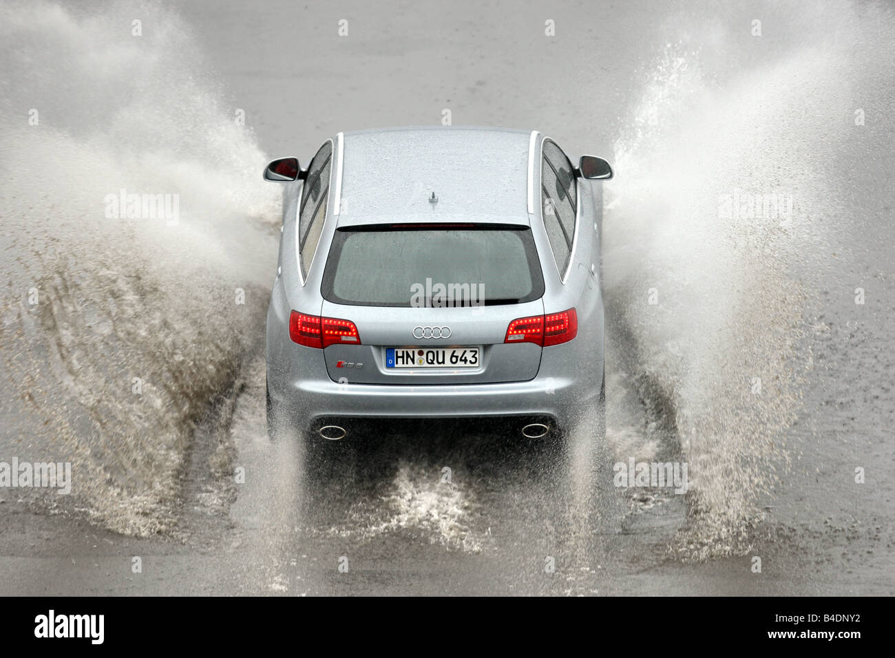 Audi RS6 Avant, model year 2008-, silver, driving, behind, rear view, test track, Water, Aquaplaning Stock Photo