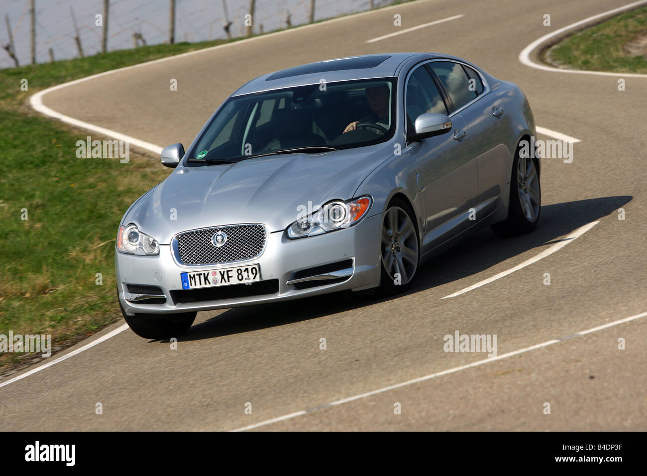 Jaguar XF 2.7 diesel engine Luxury, model year 2008-, silver, driving, diagonal from the front, frontal view, country road Stock Photo