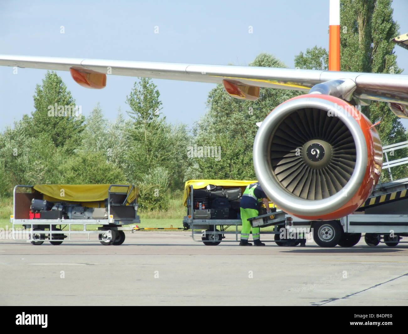 passenger luggage being transported at airport Stock Photo