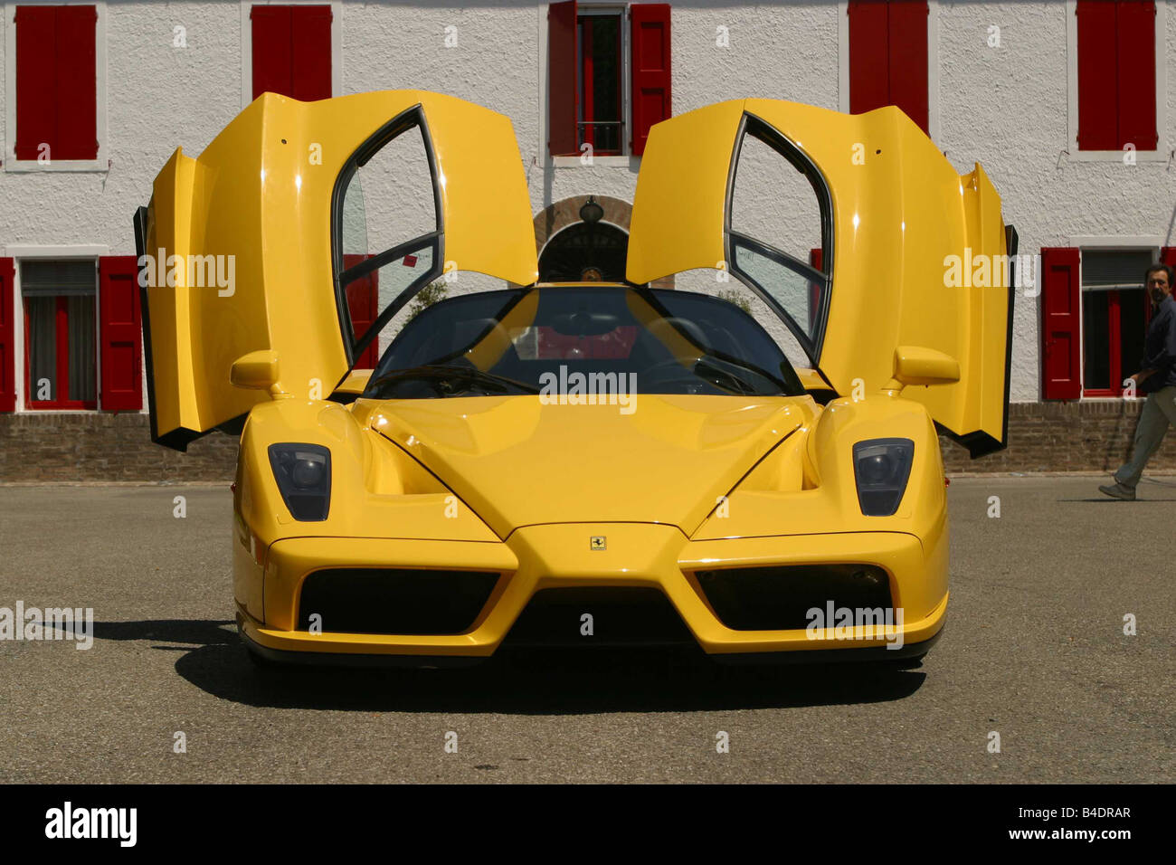 Car, Ferrari Enzo Ferrari, roadster, coupe, model year 2002-, yellow, frontal view, standing, upholding, open doors Stock Photo