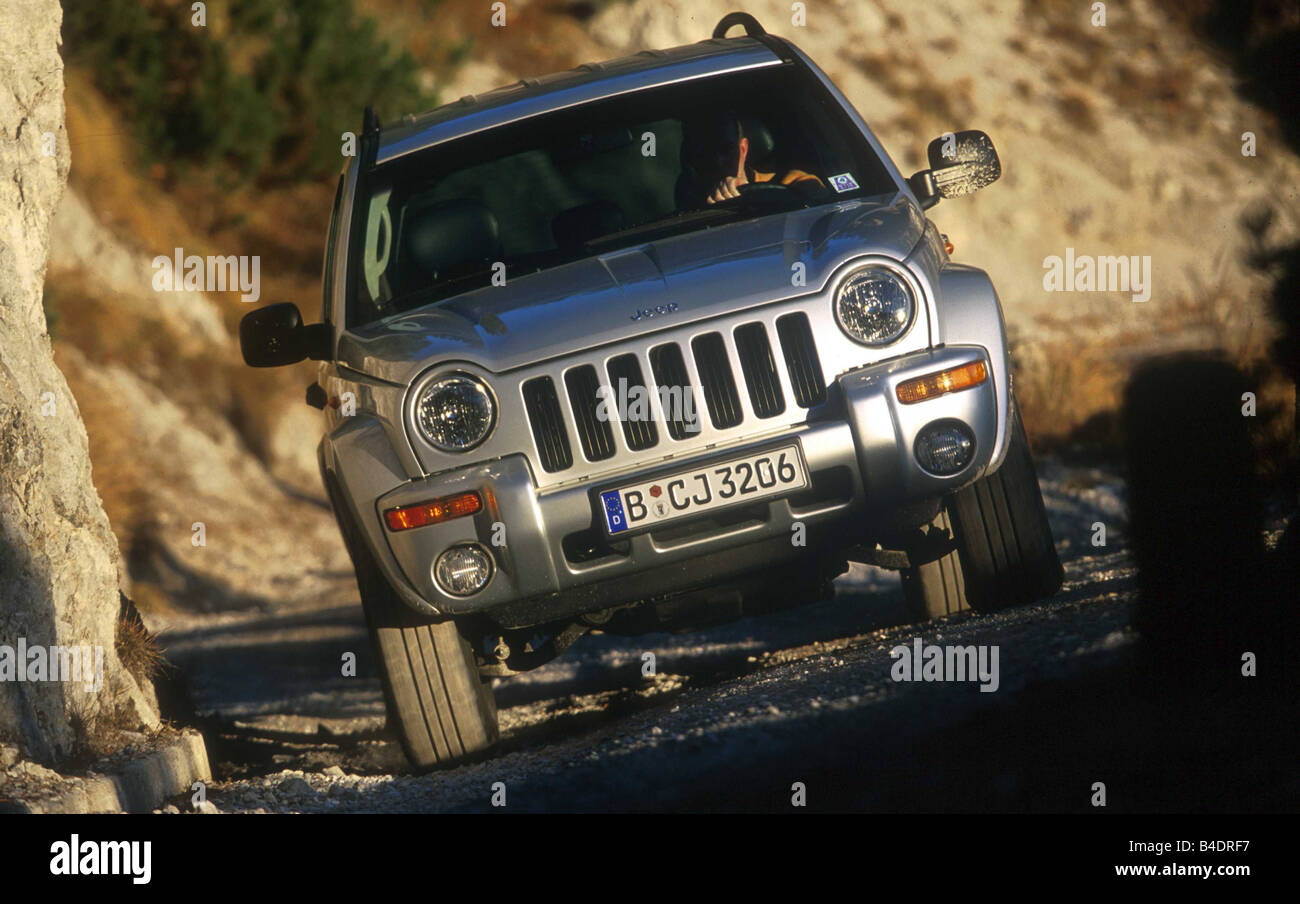 Car, Chrysler Jeep Cherokee 2.5 CRD Limited, cross country vehicle, model  year 2001-, silver, driving, offroad, diagonal from th Stock Photo - Alamy