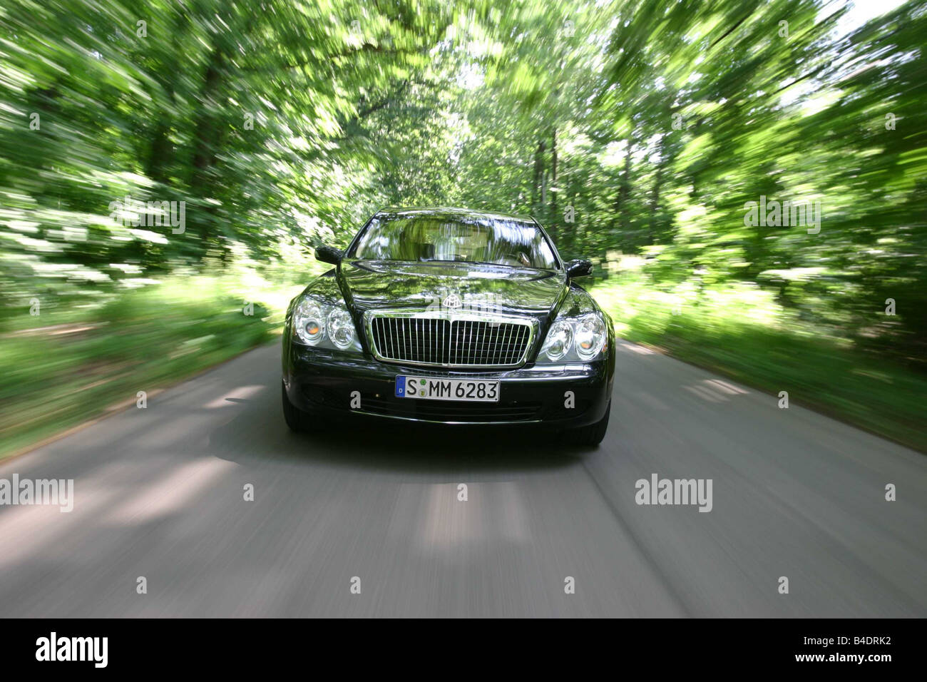 Car, Mercedes Maybach 62, Luxury approx.s, black, model year 2003-, 550 PS, € 418.000,--, driving, country road, Front view Stock Photo