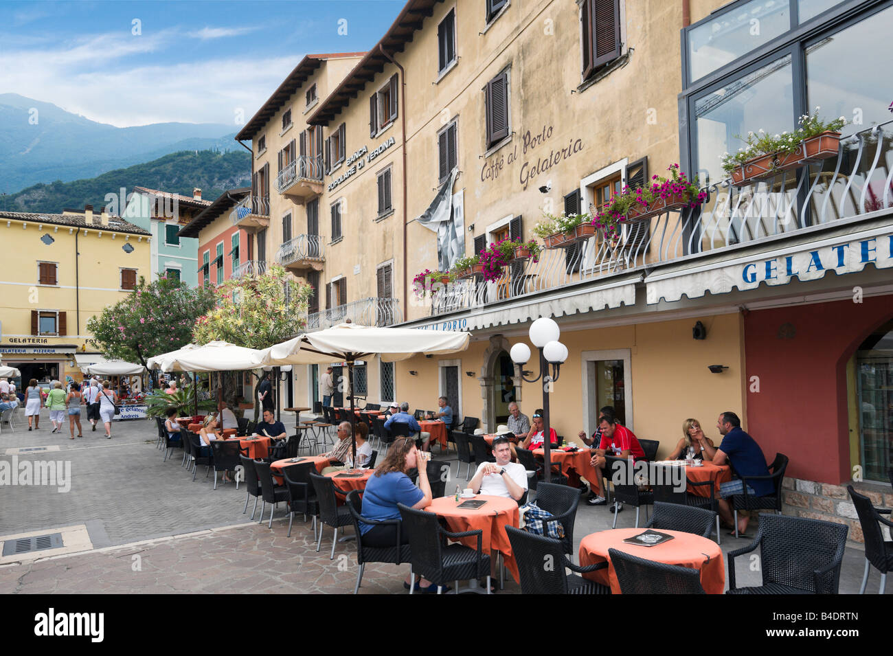 Cafe on the harbourfront in the old town, Malcesine, Lake Garda, Italy Stock Photo