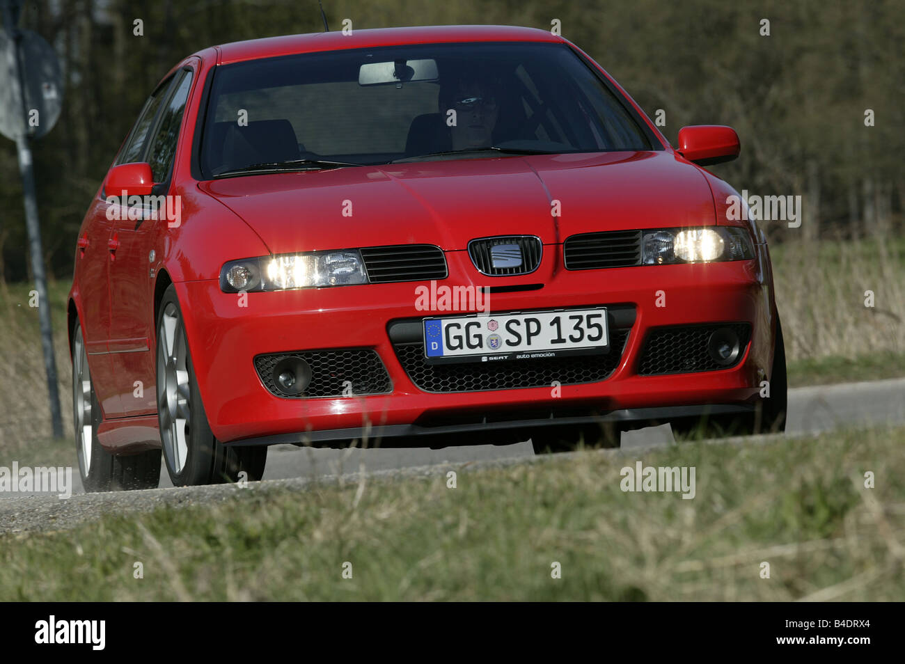 Car, Seat Leon Sport , Lower middle-sized class, Limousine, model year 1999-, red, driving, country road, diagonal from the fron Stock Photo