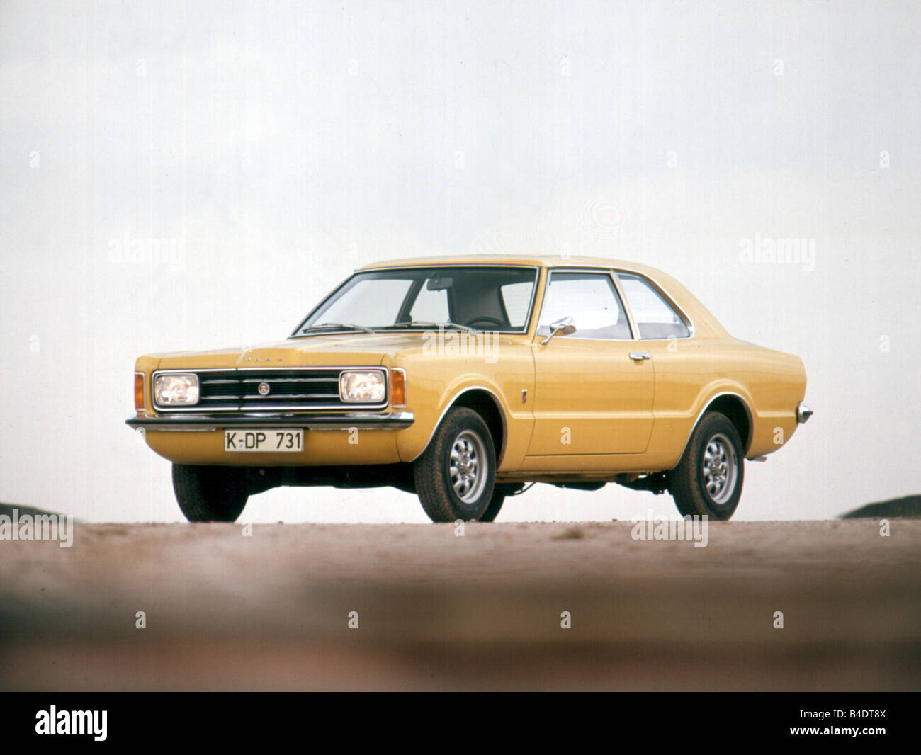 Car, Ford Taunus, yellow, model year 1973, The 70s, Limousine, standing, upholding, diagonal from the front, Front view Stock Photo