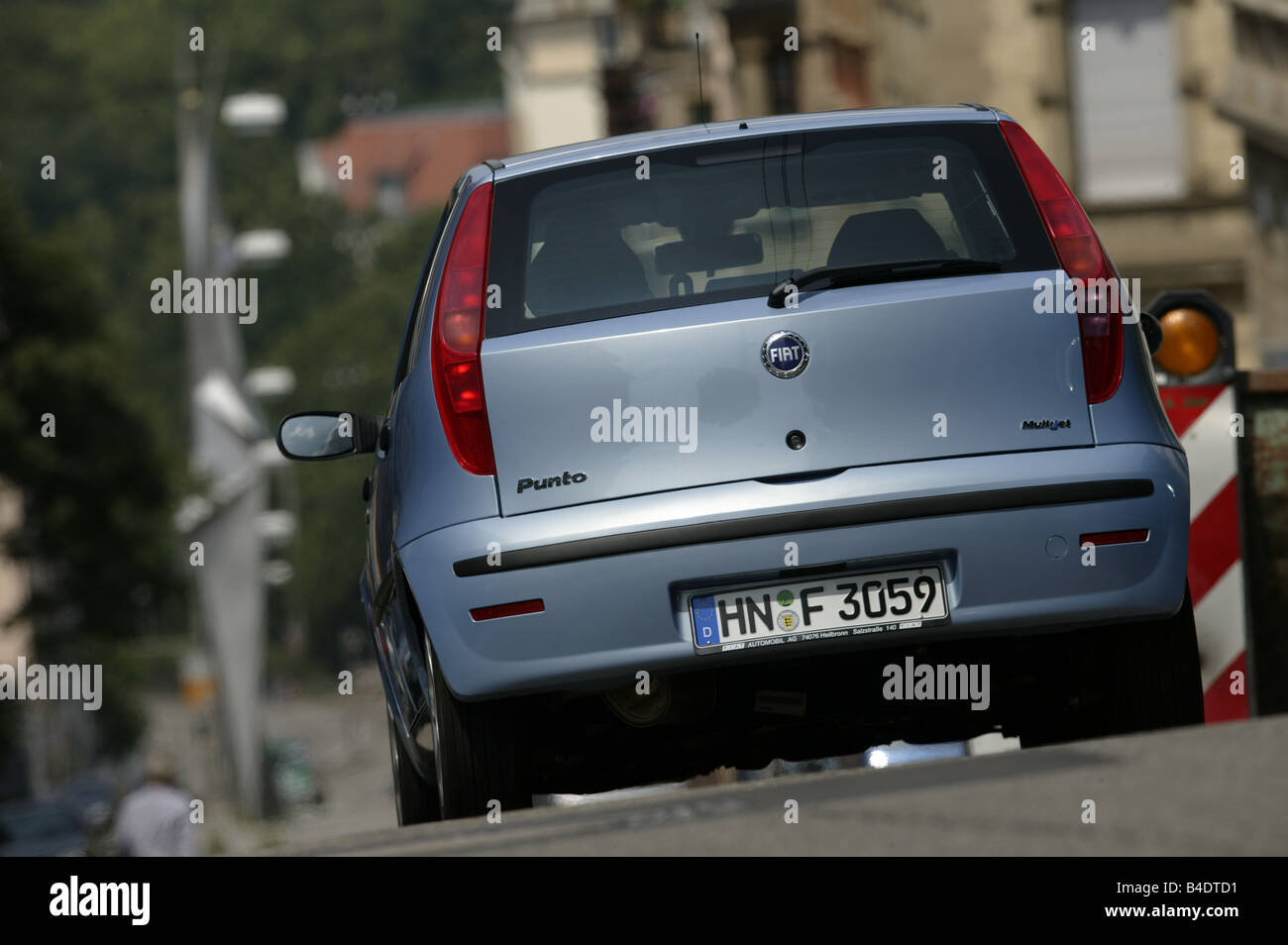 Car, Fiat Punto 1.3 JTD, small approx., Limousine, light blue-metallic,  driving, City, diagonal from the back, Rear view Stock Photo - Alamy