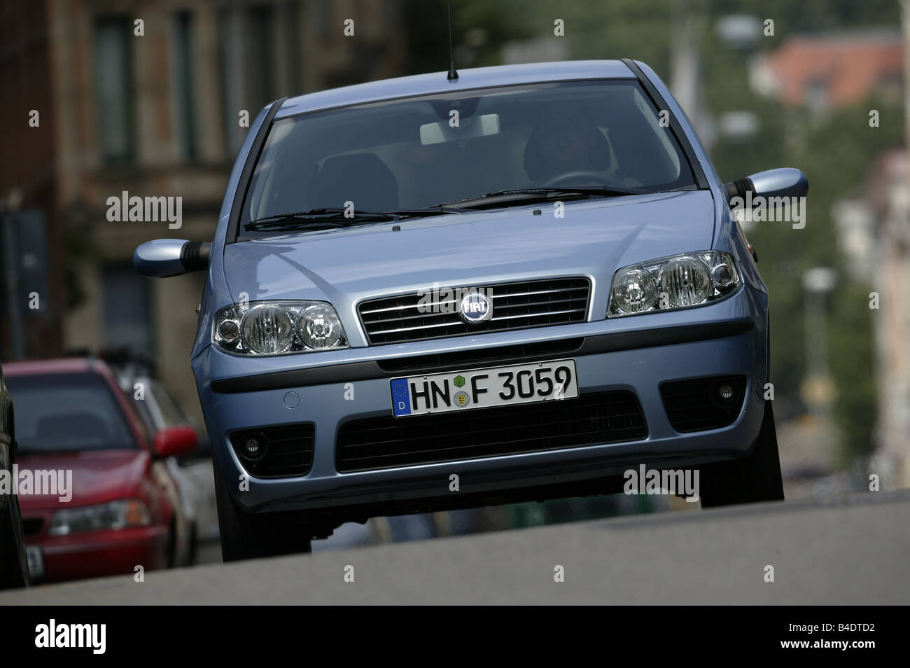 Car, Fiat Punto 1.3 JTD, small approx., Limousine, light blue-metallic,  driving, City, diagonal from the front, Front view Stock Photo - Alamy