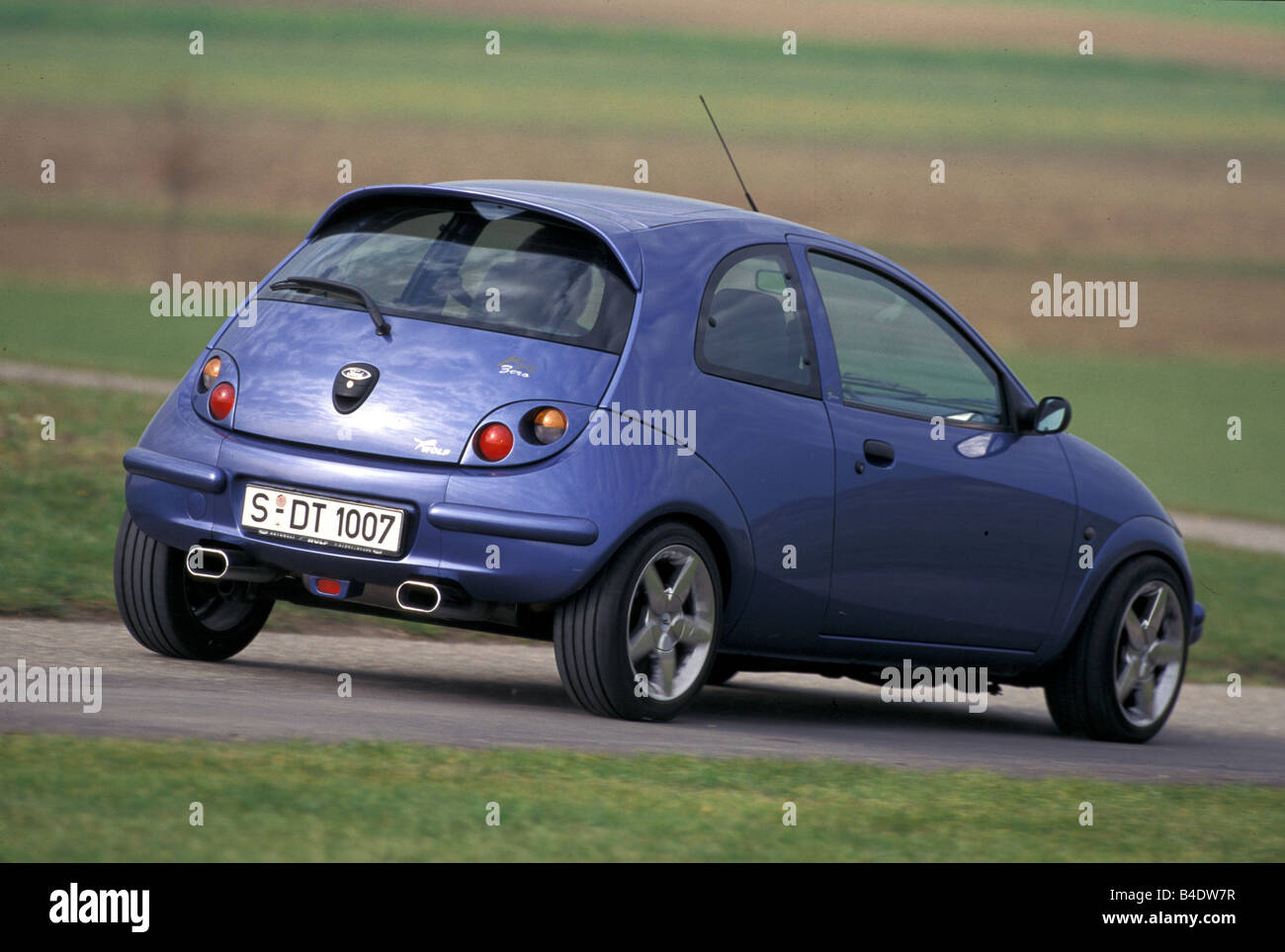 Car, Ford Ka Wolf, Limousine, Miniapprox.s, blue, model year 1996-2002, Tuning, diagonal from the back, Rear view Stock Photo