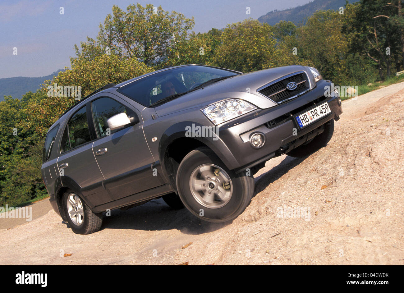 Car, Kia Sorento, cross country vehicle, model year 2002-, silver, driving, Groand, offroad, diagonal from the front, frontal vi Stock Photo