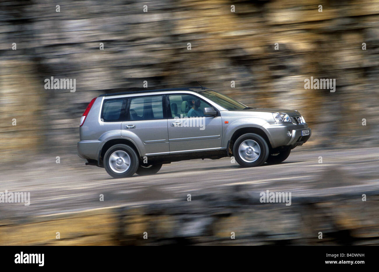 Car, Nissan X-Trail 2.0, cross country vehicle, silver, model year 2000-, side view, driving, offroad Stock Photo
