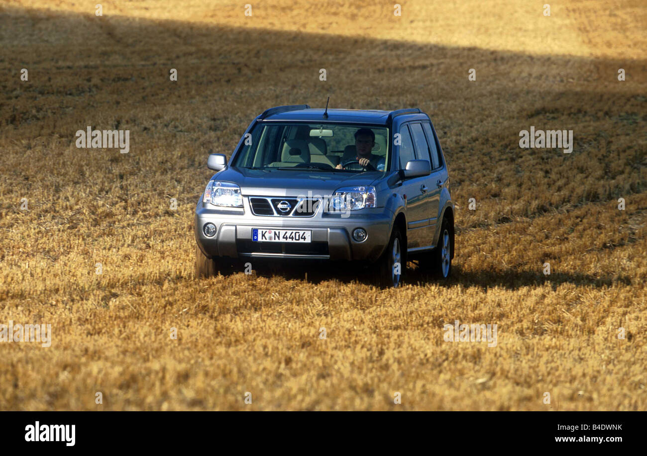 Car, Nissan X-Trail 2.0, cross country vehicle, silver, model year 2000-, diagonal from the front, frontal view, driving, offroa Stock Photo