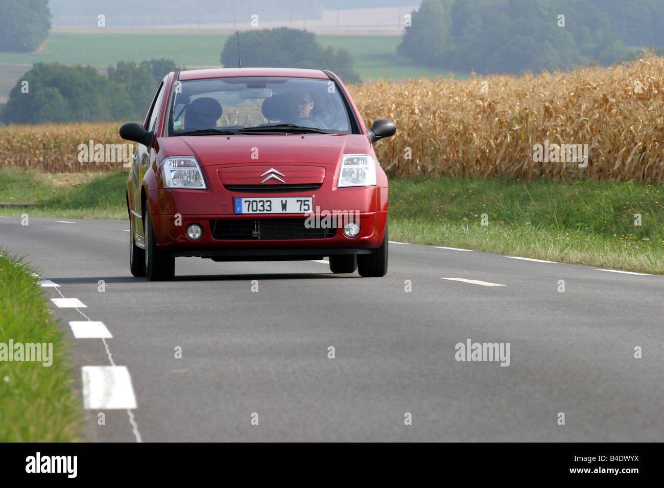 Car, Citroen C2, Miniapprox.s, Limousine, model year 2003-, driving, diagonal from the front, frontal view, country road Stock Photo