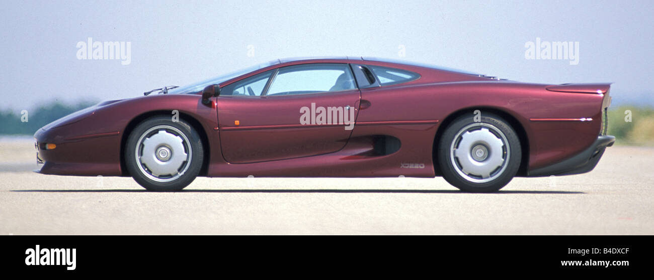 Car, Jaguar XJ 220, model year 1994, wine-red-metallic, coupe/Coupe, roadster, standing, upholding, side view Stock Photo
