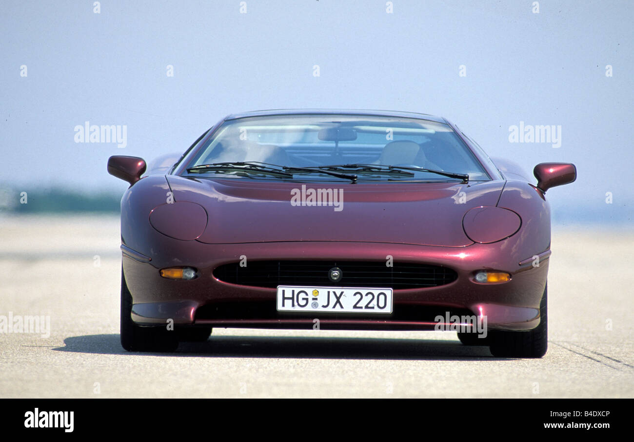 Car, Jaguar XJ 220, model year 1994, wine-red-metallic, coupe/Coupe, roadster, standing, upholding, Front view Stock Photo