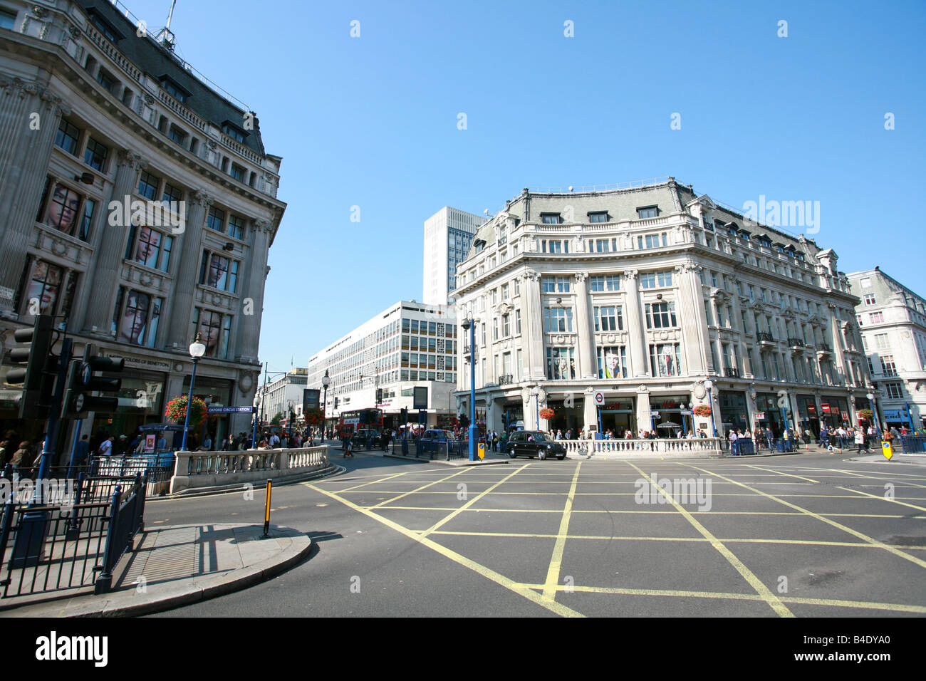 Tourists shopping in Oxford Circus where Oxford Street and Regent Street cross, major London retail shopping area district UK Stock Photo