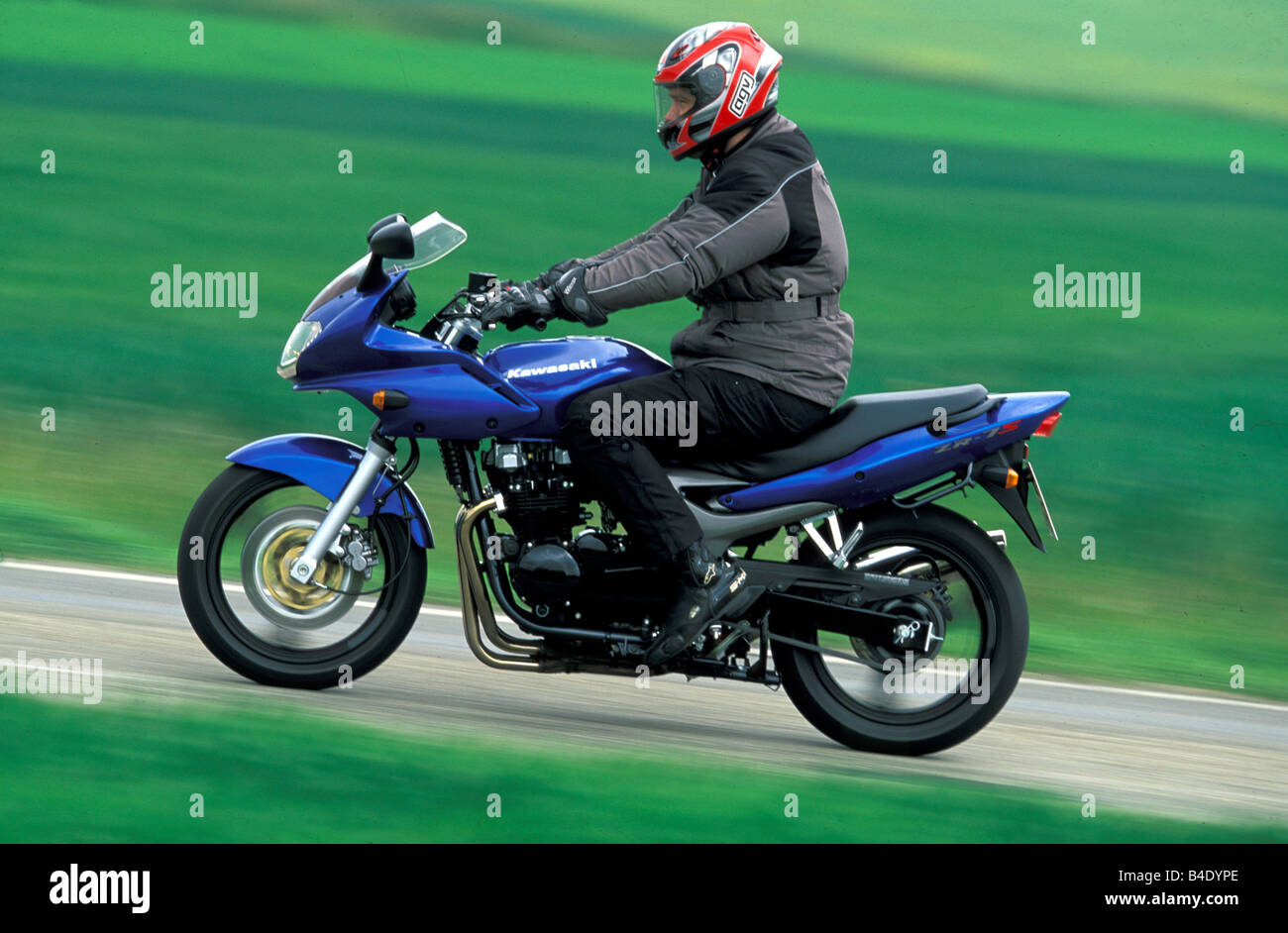 engine cycle, Sports motor cycle, Sporttourer, Kawasaki ZR-7S, blue, model  year 2003, driving, straight ahead, side view, photog Stock Photo - Alamy