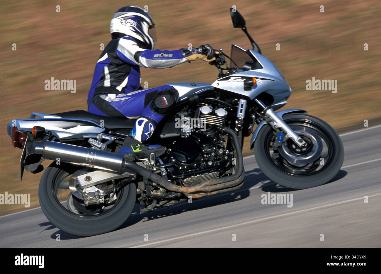 engine cycle, Sports motor cycle, Sporttourer, Yamaha FZS 600 Fazer, silver, model year 2003, driving, inclined position, Side p Stock Photo