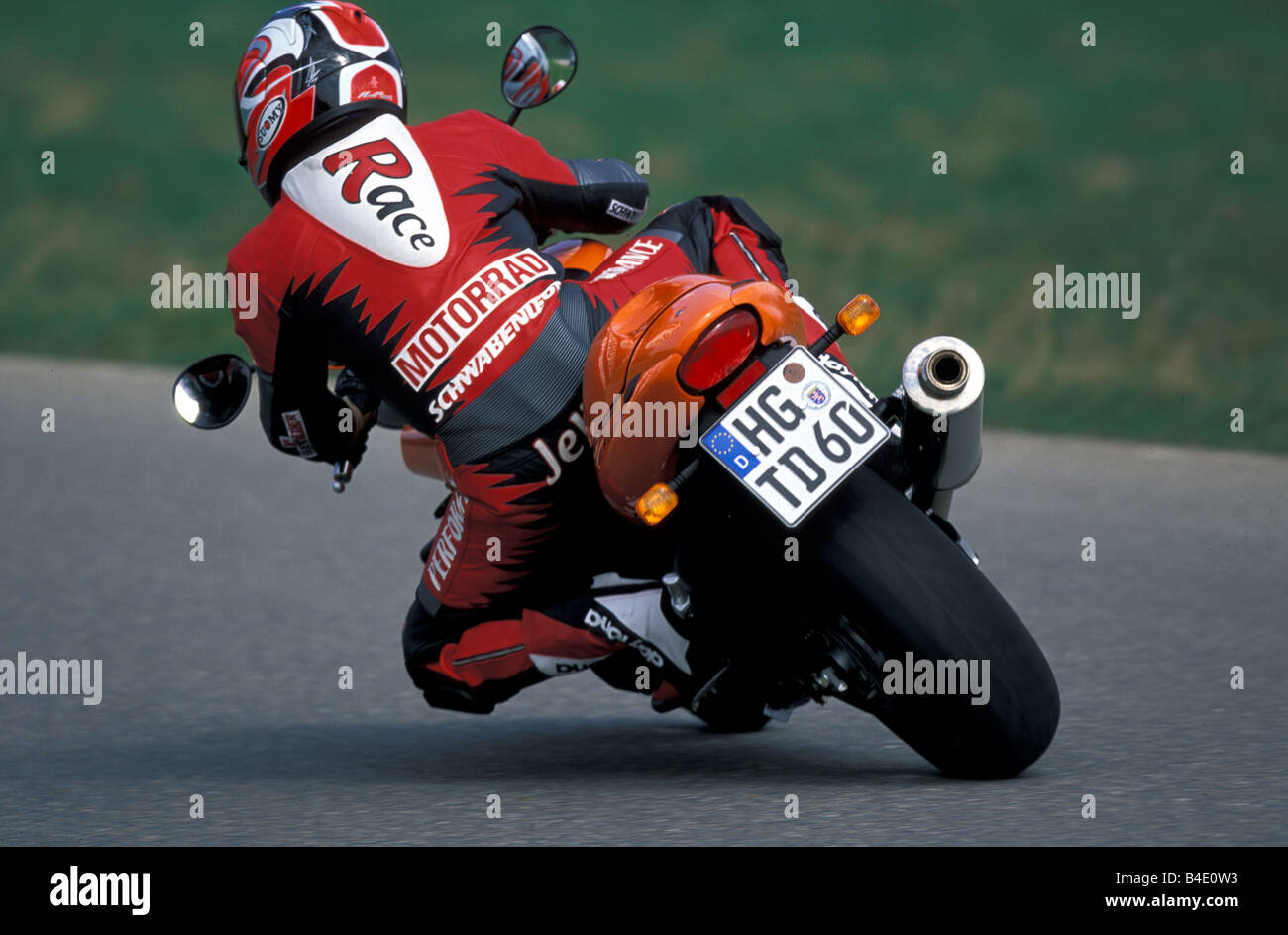 engine cycle, Street motor cycle, Naked Bike, Triumph Speed Four, orange , model year 2003, driving, inclined position, Side pos Stock Photo