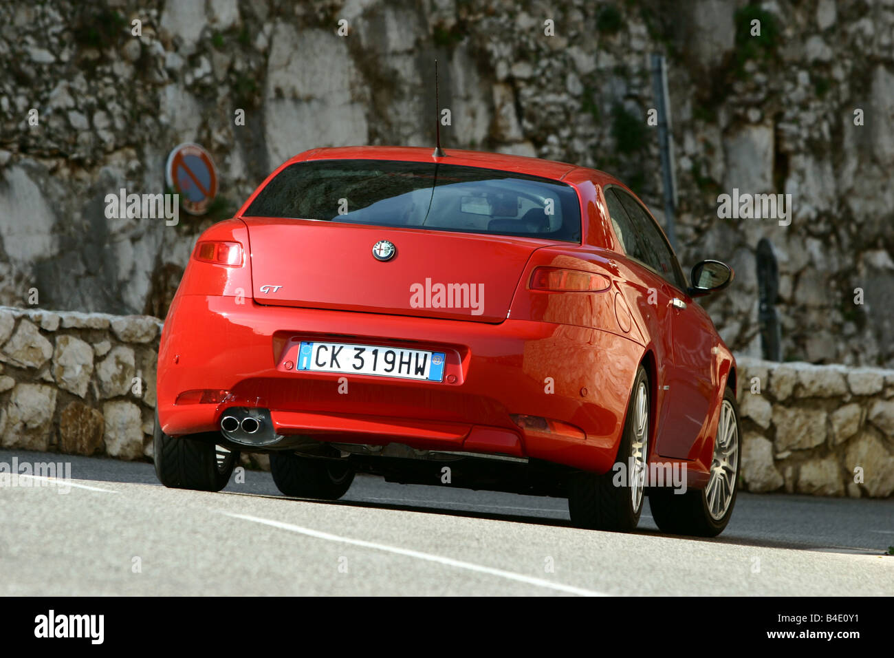 Car, Alfa Romeo GT 3.2 V6, roadster, coupe/Coupe, red, model year 2003-,  driving, diagonal from the back, rear view, country roa Stock Photo - Alamy