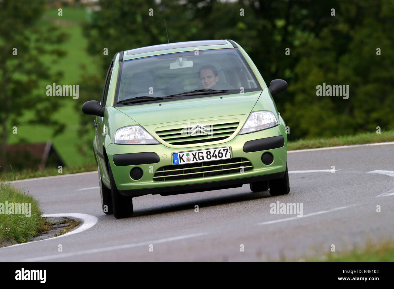 Car, Citroen C3 1.4 HDI, Limousine, small approx., model year 2002-, green, driving, diagonal from the front, frontal view, coun Stock Photo