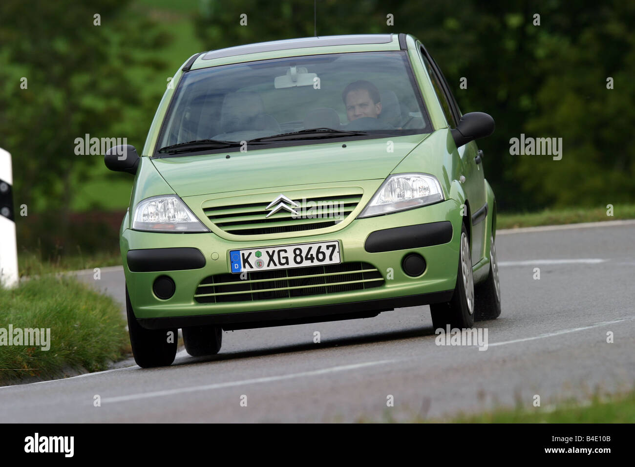 Car, Citroen C3 1.4 HDI, Limousine, small approx., model year 2002-, green, driving, diagonal from the front, frontal view, coun Stock Photo