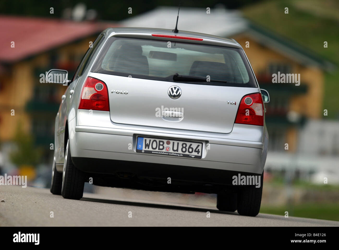 Car, VW Volkswagen Polo 1.4 TDI, small approx., Limousine, silver, model year 2002-, driving, diagonal from the back, rear view Stock - Alamy
