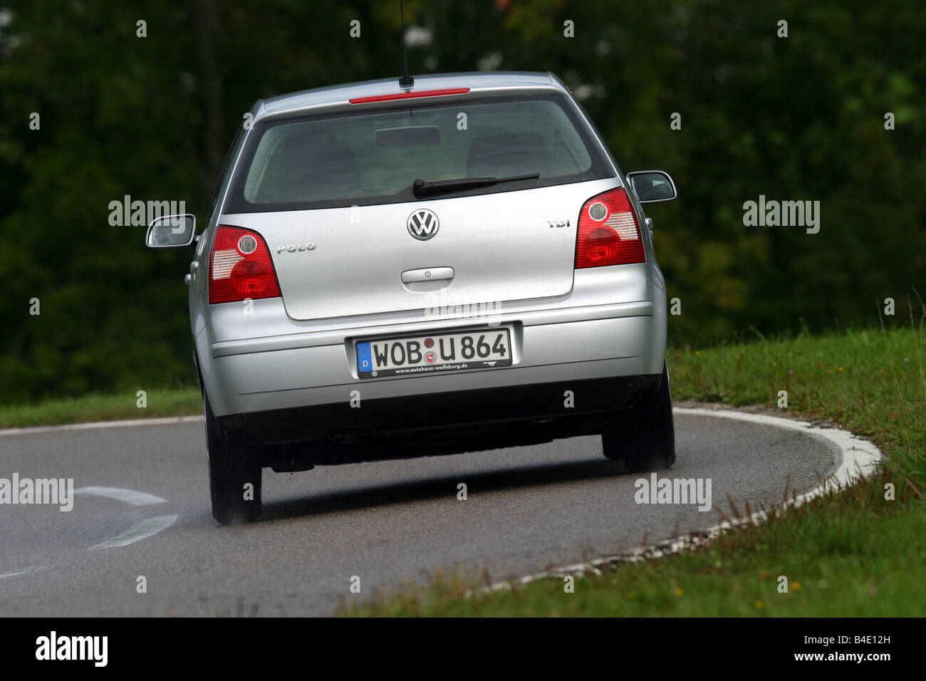 Car, VW Volkswagen Polo 1.4 TDI, small approx., Limousine, silver, model  year 2002-, driving, diagonal from the back, rear view Stock Photo - Alamy