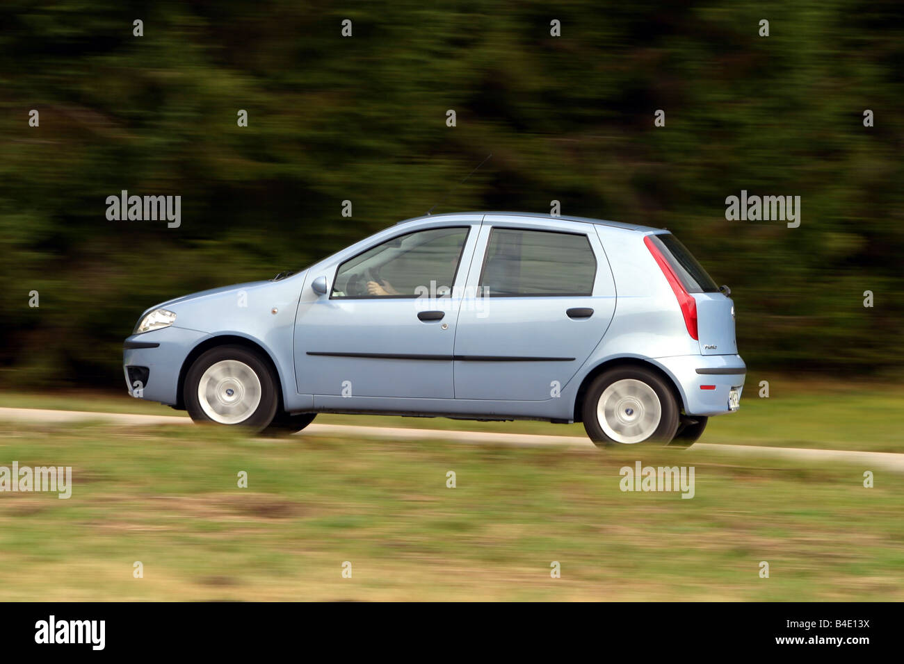 Car, Fiat Punto 1.3 JTD, small approx., Limousine, model year 2003-, silver, driving, side view, country road Stock Photo