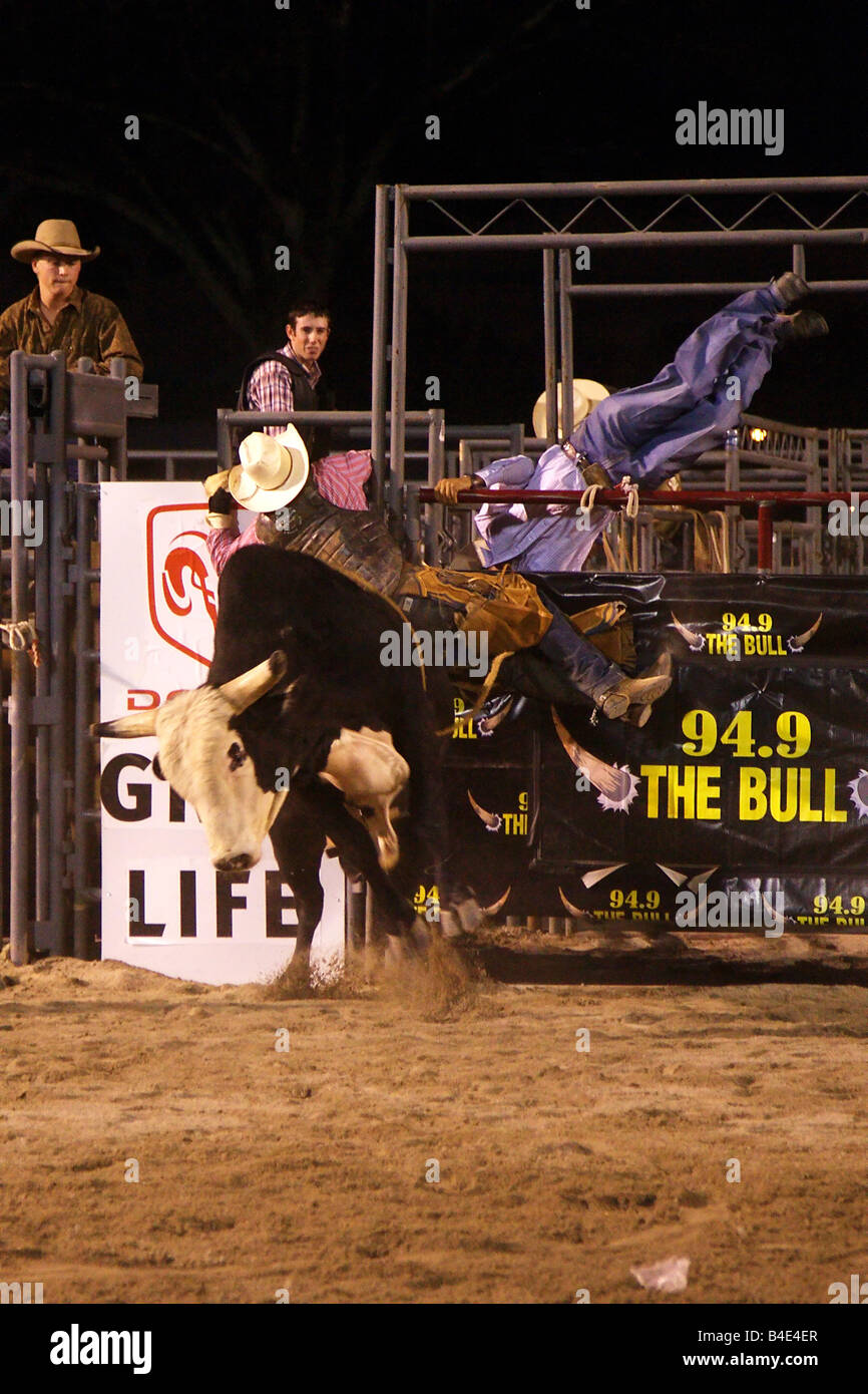 Professional Bull Rider (PBR) riding a bull. Rockdale County Fair ...