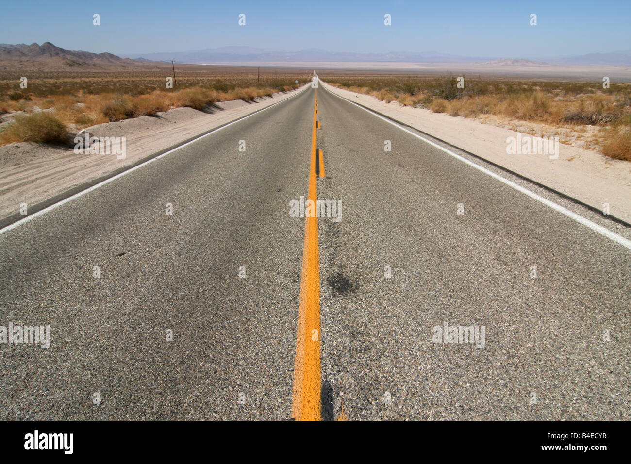 Open desert road betweeen Joshua Tree National Park and Highway 40, in